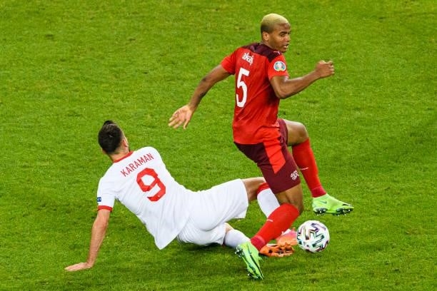 Manuel Akanji of Switzerland battles for the ball with Kenan Karaman of Turkey during the UEFA Euro 2020 Championship Group A match between...