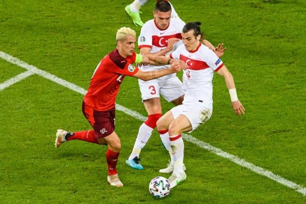 Granit Xhaka of Switzerland fights for the ball with Caglar Soyuncu of Turkey during the UEFA Euro 2020 Championship Group A match between...