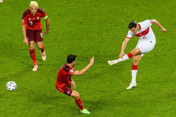 Yusuf Yazici of Turkey attempts a kick while being defended by Remo Freuler of Switzerland during the UEFA Euro 2020 Championship Group A match...