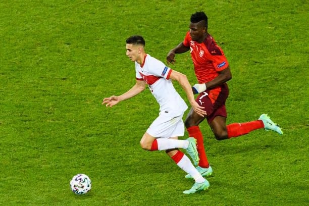 Mert Muldur of Turkey is chased by Breel Embolo of Switzerland during the UEFA Euro 2020 Championship Group A match between Switzerland and Turkey on...
