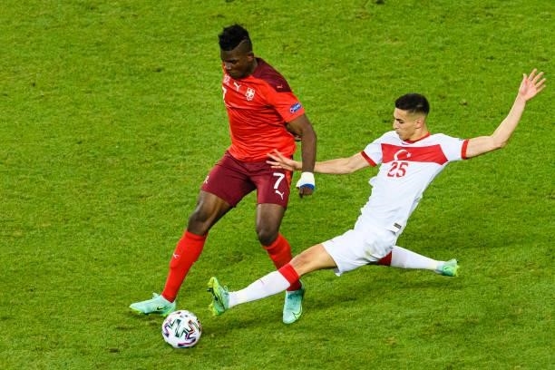 Mert Muldur of Turkey battles for the ball with Breel Embolo of Switzerland during the UEFA Euro 2020 Championship Group A match between Switzerland...