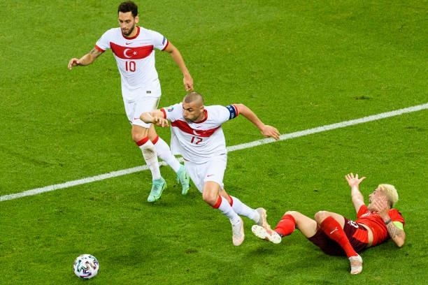 Granit Xhaka of Switzerland is challenged by Burak Yilmaz of Turkey during the UEFA Euro 2020 Championship Group A match between Switzerland and...
