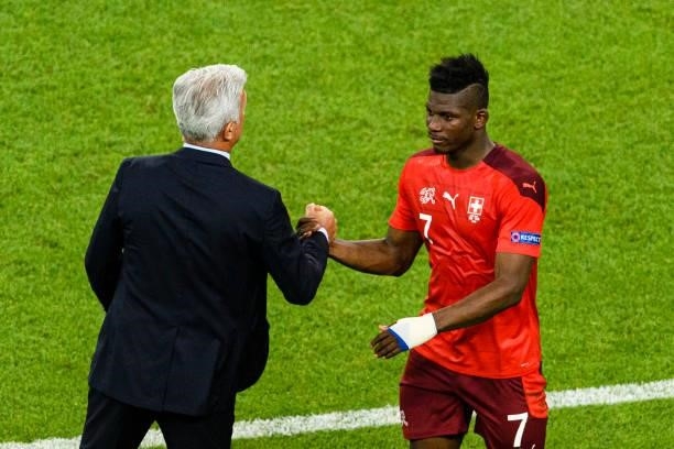 Switzerland Head Coach Vladimir Petkovic high five his teammate Breel Embolo of Switzerland during the UEFA Euro 2020 Championship Group A match...