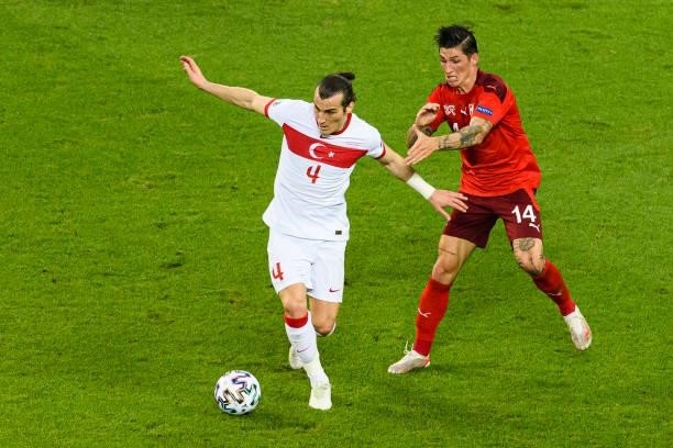 Caglar Soyuncu of Turkey is chased by Steven Zuber of Switzerland during the UEFA Euro 2020 Championship Group A match between Switzerland and Turkey...