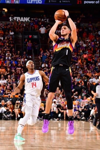Devin Booker of the Phoenix Suns shoots a three-pointer during the game against the LA Clippers during Game 1 of the Western Conference Finals of the...