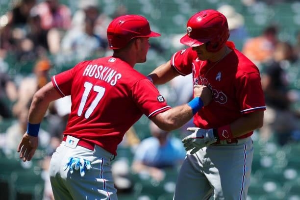 Realmuto of the Philadelphia Phillies celebrates with Rhys Hoskins after hitting a home run during the game between the Philadelphia Phillies and the...