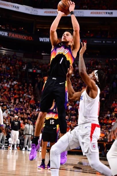 Devin Booker of the Phoenix Suns shoots a three-pointer during the game against the LA Clippers during Game 1 of the Western Conference Finals of the...