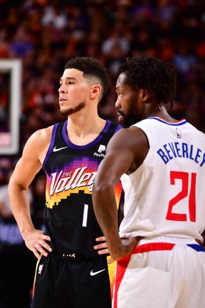 Devin Booker of the Phoenix Suns and Patrick Beverley of the LA Clippers look on during Game 1 of the Western Conference Finals of the 2021 NBA...