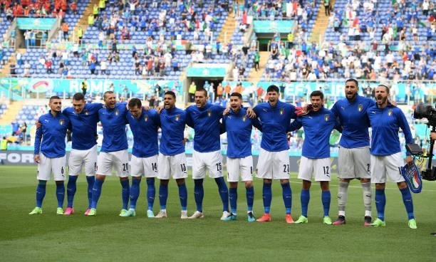 Italian team sing their national anthem during the UEFA Euro 2020 Championship Group A match between Italy and Wales at Olimpico Stadium on June 20,...
