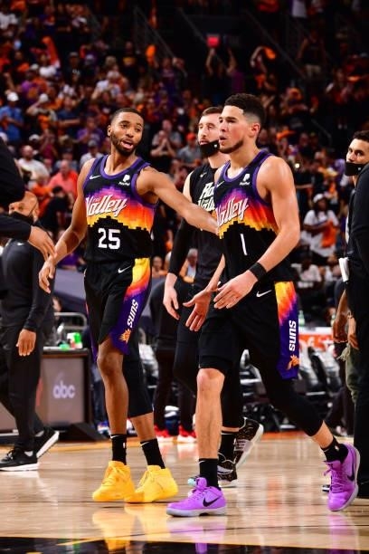 Mikal Bridges and Devin Booker of the Phoenix Suns look on during the game against the LA Clippers during Game 1 of the Western Conference Finals of...
