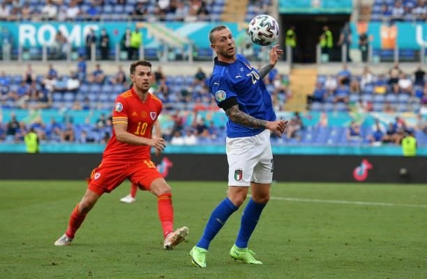 Federico Bernardeschi of Italy evades challenge from Aaron Ramsey of Wales during the UEFA Euro 2020 Championship Group A match between Italy and...