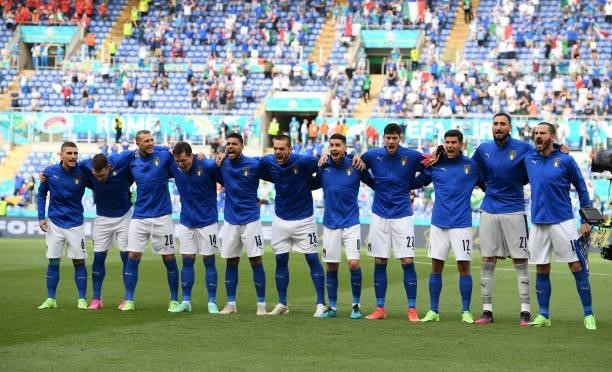 Italian team sing their national anthem during the UEFA Euro 2020 Championship Group A match between Italy and Wales at Olimpico Stadium on June 20,...
