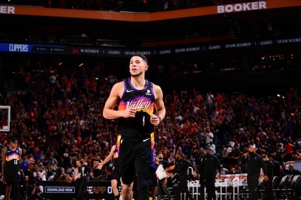 Devin Booker of the Phoenix Suns smiles during the game against the LA Clippers during Game 1 of the Western Conference Finals of the 2021 NBA...