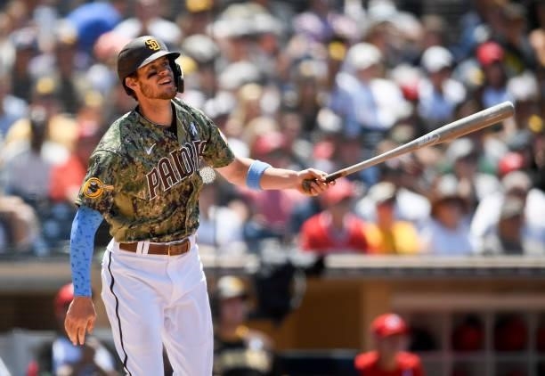 Wil Myers of the San Diego Padres hits a triple during the third inning of a baseball game against the Cincinnati Reds at Petco Park on June 20, 2021...