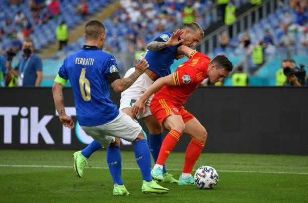 Connor Roberts of Wales challenged by Federico Bernardeschi of Italy and Marco Verratti of Italy during the UEFA Euro 2020 Championship Group A match...