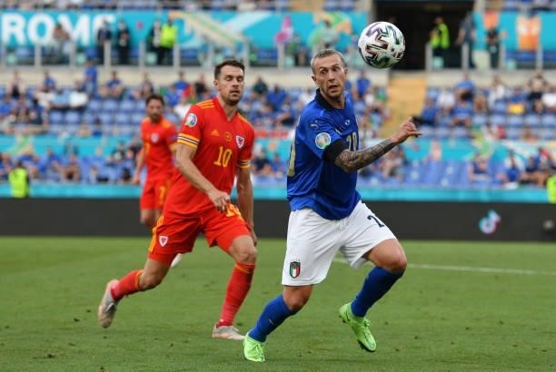 Federico Bernardeschi of Italy evades challenge from Aaron Ramsey of Wales during the UEFA Euro 2020 Championship Group A match between Italy and...