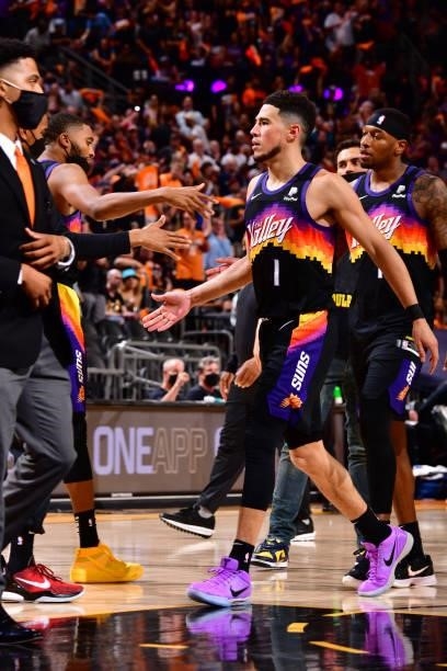 Devin Booker of the Phoenix Suns high-fives teammates during the game against the LA Clippers during Game 1 of the Western Conference Finals of the...
