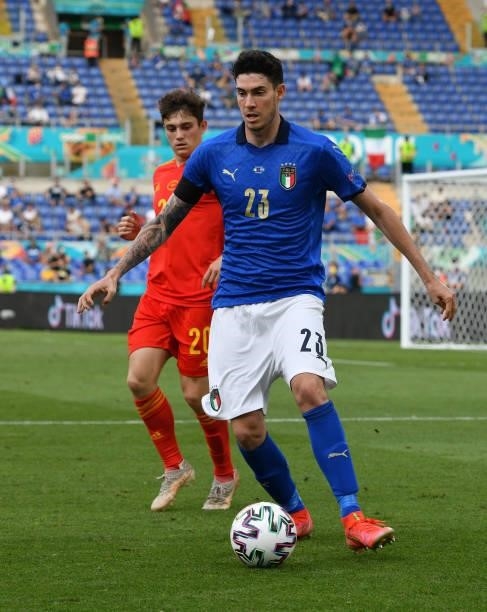Alessandro Bastoni of Italy evades a challenge from Daniel James of Wales during the UEFA Euro 2020 Championship Group A match between Italy and...