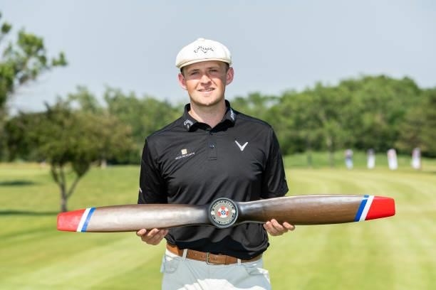 Harry Hall of England poses with the trophy after wining the Wichita Open Benefitting KU Wichita Pediatrics at Crestview Country Club on June 20,...