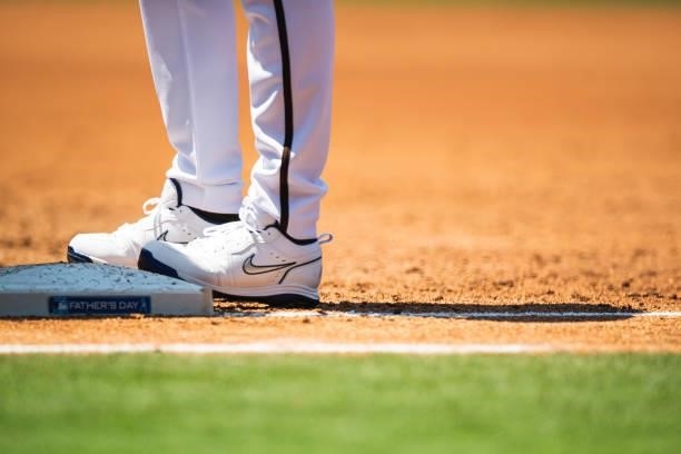 The Jordan brand player exclusive Father's Day cleats of Manny Machado of the San Diego Padres in the third inning against the Cincinnati Reds on...