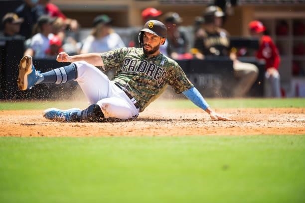 Eric Hosmer of the San Diego Padres scores in the third inning against the Cincinnati Reds on June 20, 2021 at Petco Park in San Diego, California.