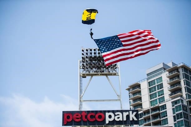 The Leap Frogs Navy Parachute Team descend into the ballpark before the San Diego Padres face against the Cincinnati Reds on June 20, 2021 at Petco...