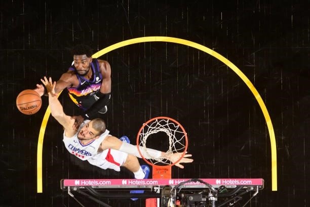 Deandre Ayton of the Phoenix Suns and Ivica Zubac of the LA Clippers reach for a rebound during Game 1 of the Western Conference Finals of the 2021...