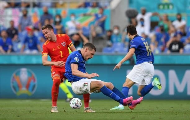 Andrea Belotti of Italy challenged by Chris Gunter of Wales during the UEFA Euro 2020 Championship Group A match between Italy and Wales at Olimpico...