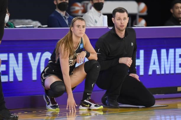 Sabrina Ionescu of the New York Liberty and Head Coach Walt Hopkins look on during the game against the Los Angeles Sparks on June 20, 2021 at the...