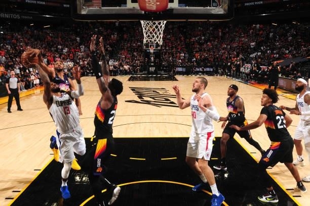 Mikal Bridges of the Phoenix Suns blocks a shot by Paul George of the LA Clippers during Game 1 of the Western Conference Finals of the 2021 NBA...