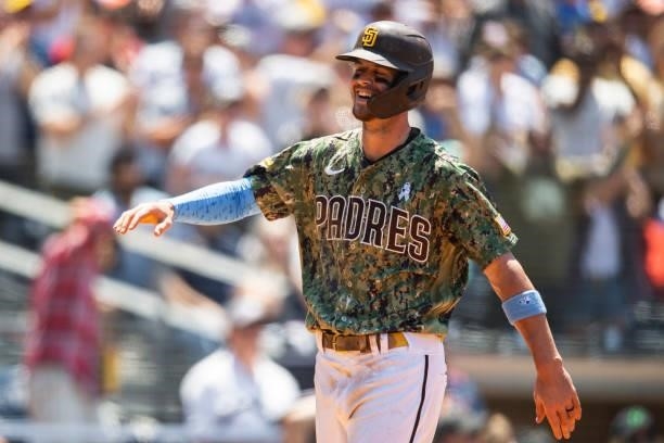Wil Myers of the San Diego Padres smiles after scoring a run in the third inning against the Cincinnati Reds on June 20, 2021 at Petco Park in San...