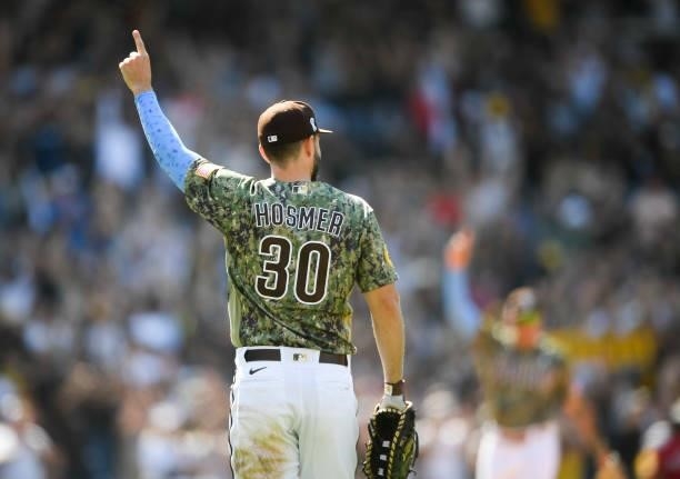 Eric Hosmer of the San Diego Padres points skyward after the Padres got the final out during the ninth inning of a baseball game against the...