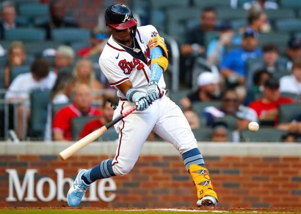 Ronald Acuna Jr. #13 of the Atlanta Braves hits his 100th career home run in the third inning of game two of a doubleheader against the St. Louis...