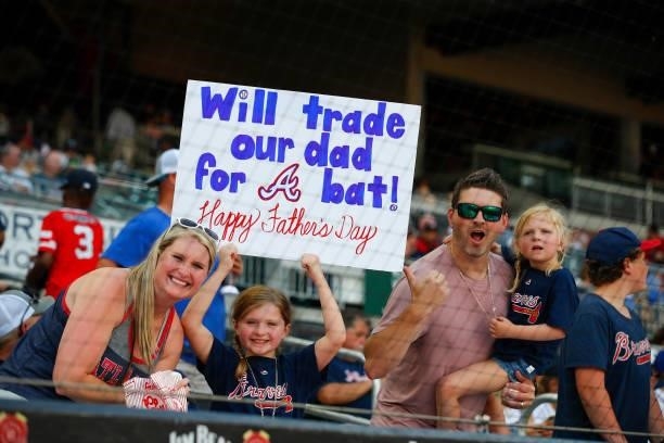 Atlanta Braves fans celebrate Fathers Day at the ball park prior to game two of a doubleheader against the St. Louis Cardinals at Truist Park on June...