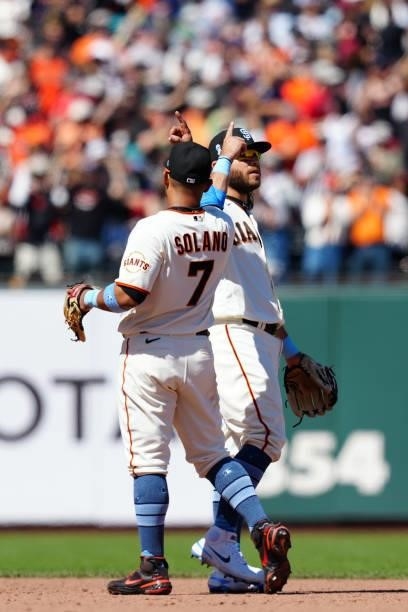 Donovan Solano of the San Francisco Giants and Brandon Crawford celebrate after the game between the Philadelphia Phillies and the San Francisco...
