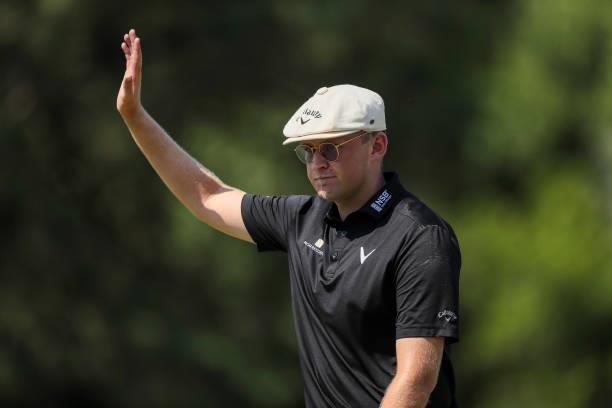 Harry Hall of England acknowledges the crowd on from the 18th hole during the final round of the Wichita Open Benefitting KU Wichita Pediatrics at...