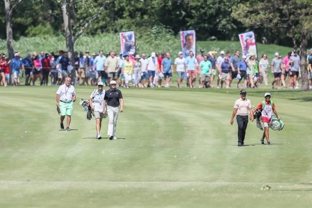Harry Hall of England and Kevin Yu of Chinese Taipei walk to the 18th green during the final round of the Wichita Open Benefitting KU Wichita...