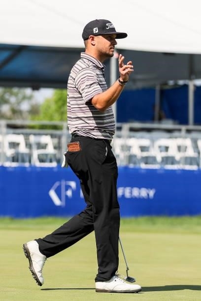 Kevin Lucas acknowledges the crowd after sinking his putt on the 17th green during the final round of the Wichita Open Benefitting KU Wichita...