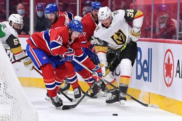 June 20: Jesperi Kotkaniemi of the Montreal Canadiens battles for the puck against Patrick Brown of the Vegas Golden Knights in Game Four of the...