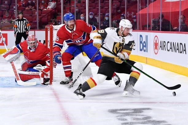 June 20: Reilly Smith of the Vegas Golden Knights controls the puck while being challenged by Jeff Petry of the Montreal Canadiens in Game Four of...