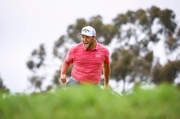 Jon Rahm of Spain celebrates with a fist pump after making a birdie putt on the 17th hole green during the final round of the 121st U.S. Open on the...