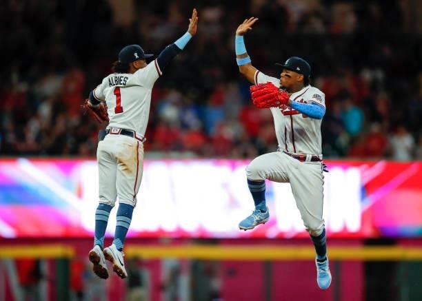 Ozzie Albies and Ronald Acuna Jr. #13 of the Atlanta Braves react at the conclusion of game two of a doubleheader against the St. Louis Cardinals at...