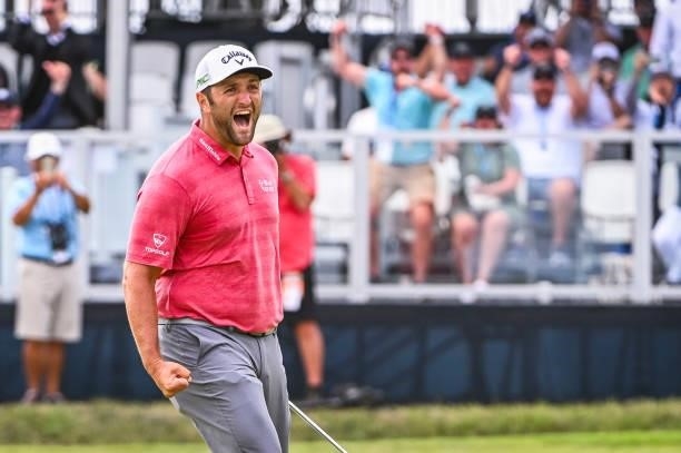 Jon Rahm of Spain celebrates with a fist pump after making a birdie putt on the 18th hole green during the final round of the 121st U.S. Open on the...