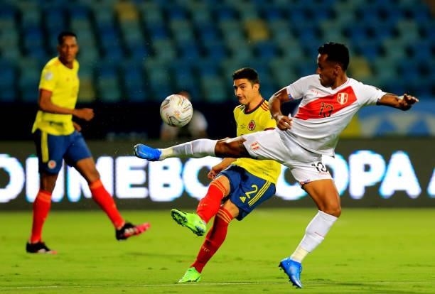 Stefan Medina of Colombia competes for the ball with Renato Tapia of Peru during the match between Colombia and Peru as part of Conmebol Copa America...