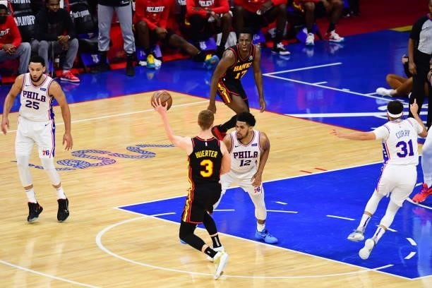 Kevin Huerter of the Atlanta Hawks passes the ball to Onyeka Okongwu of the Atlanta Hawks during Round 2, Game 7 of the 2021 NBA Playoffs on June 20,...