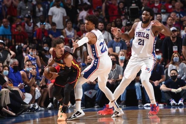 Joel Embiid of the Philadelphia 76ers and Matisse Thybulle of the Philadelphia 76ers play defense against Trae Young of the Atlanta Hawks during...