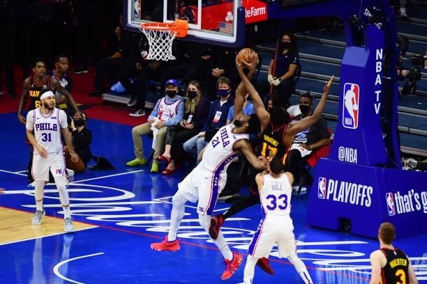 Joel Embiid of the Philadelphia 76ers rebounds the ball against the Atlanta Hawks during Round 2, Game 7 of the 2021 NBA Playoffs on June 20, 2021 at...