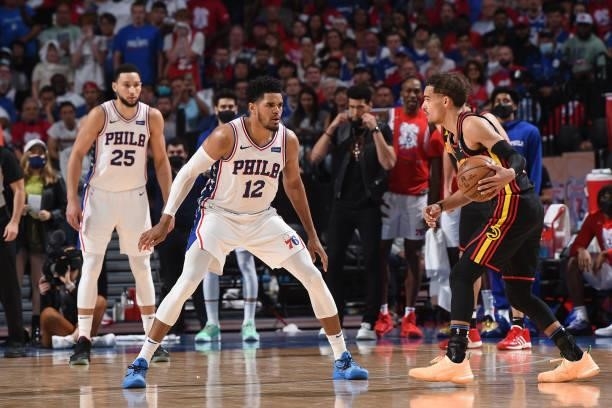 Tobias Harris of the Philadelphia 76ers plays defense against Trae Young of the Atlanta Hawks during Round 2, Game 7 of the Eastern Conference...