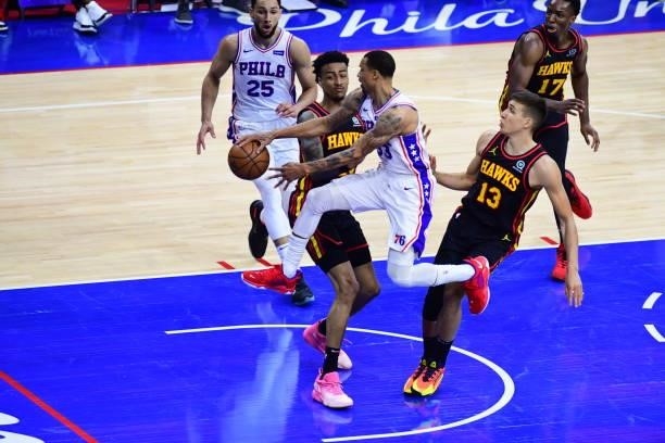 George Hill of the Philadelphia 76ers passes the ball to Ben Simmons of the Philadelphia 76ers during Round 2, Game 7 of the 2021 NBA Playoffs on...