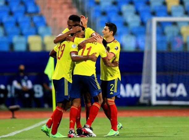 Miguel Borja of Colombia celebrates with his teammates Juan Cuadrado, Yerry Mina and Stefan Medina after scoring a penalty during the match between...